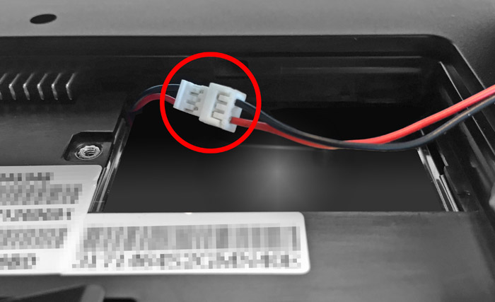 This figure shows the battery connector cable with the plastic connectors highlighted. This figure shows the battery connector cable with the plastic connectors highlighted.