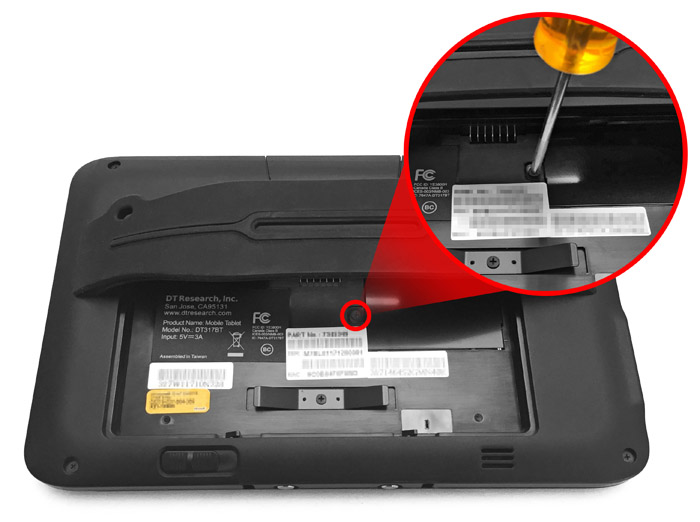 This figure depicts removing the bridge battery cover with a screwdriver. This figure depicts removing the bridge battery cover with a screwdriver.